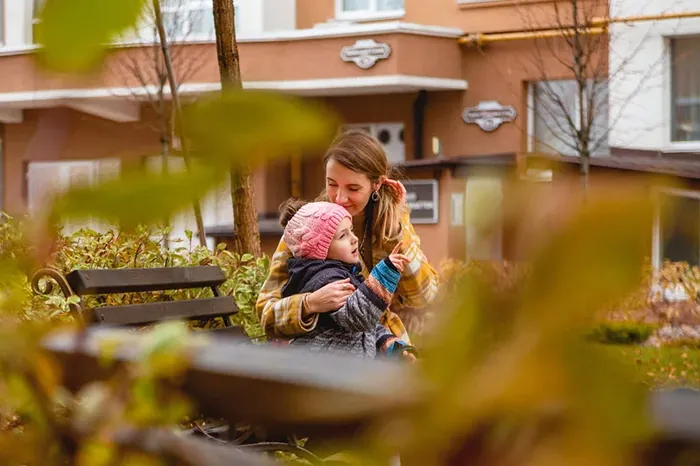 Mother holding her child — protecting the people who matter most